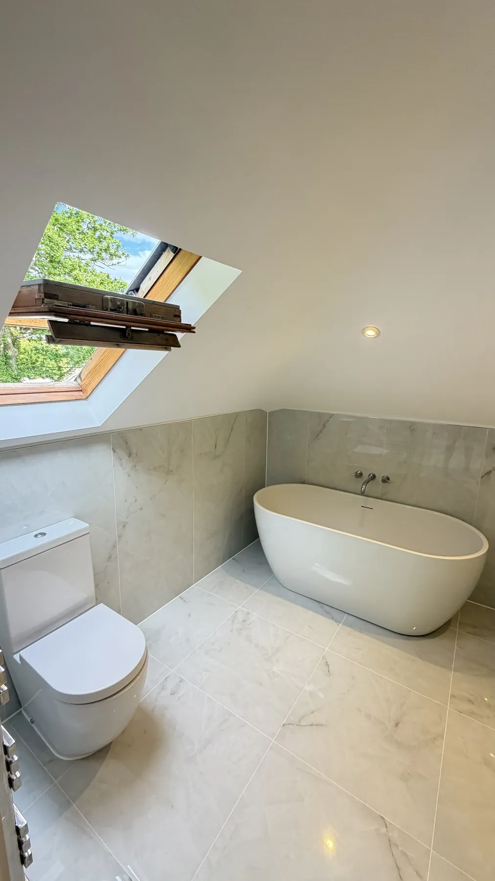 Completed modern bathroom with freestanding bath